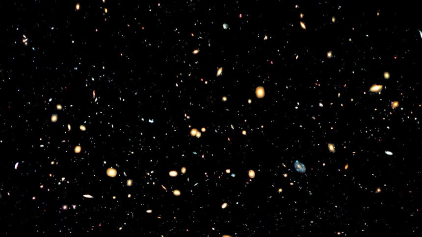 While flying through outer space countless glowing galaxies and stars are passed by