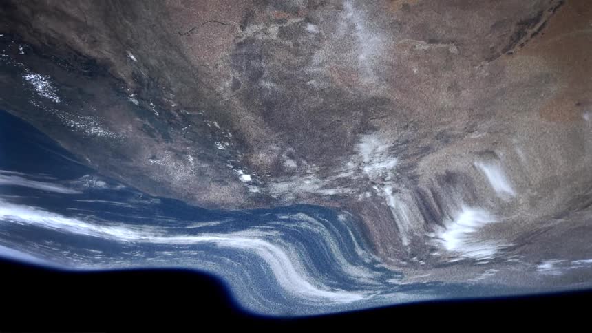 View of earth from space stretches and twists against darkness of space