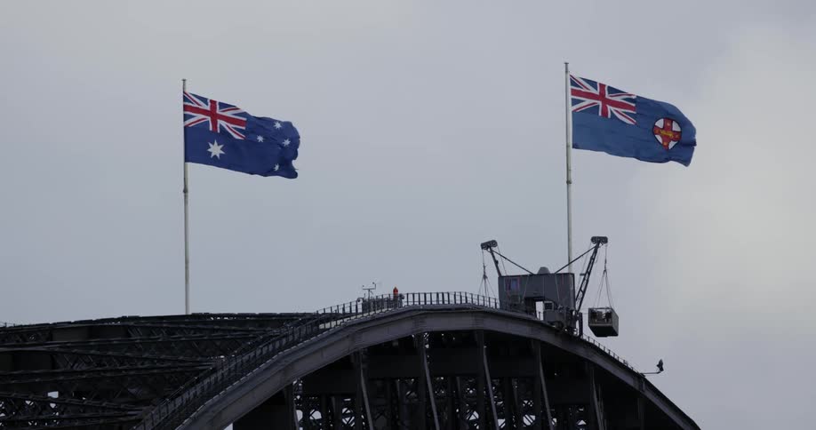 The flags in the wind above the bridge