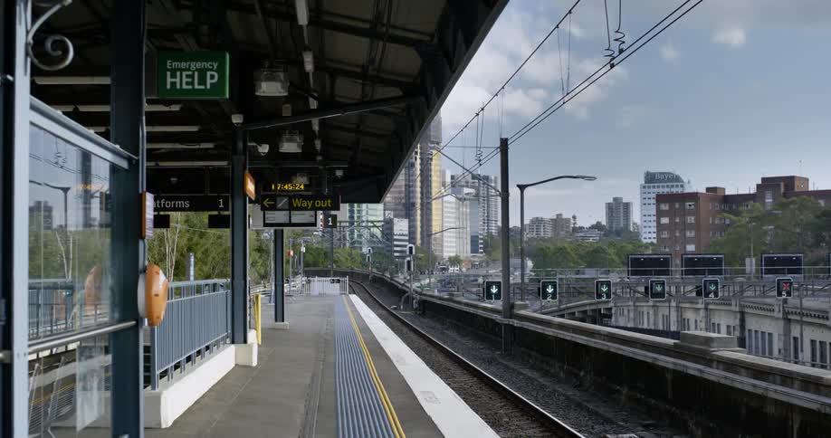 A train station is surrounded by skyscrapers in a city