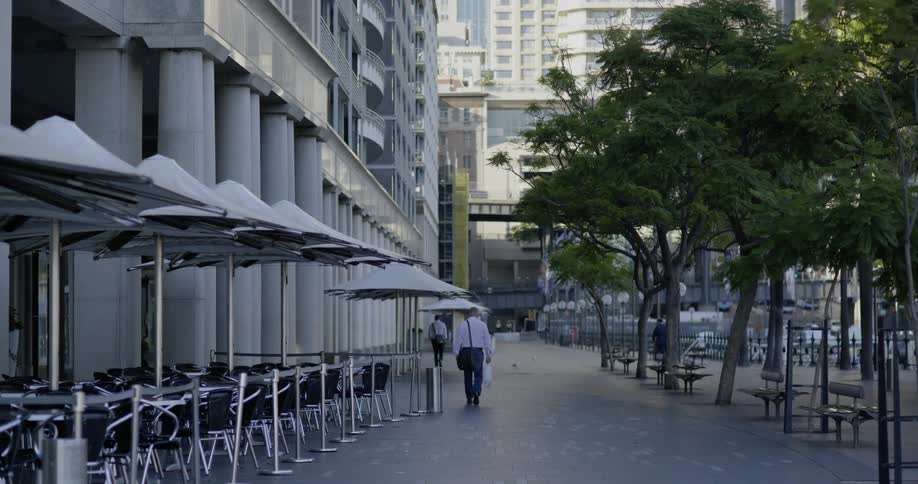 An empty cafe with chairs and tables on the street in downtown