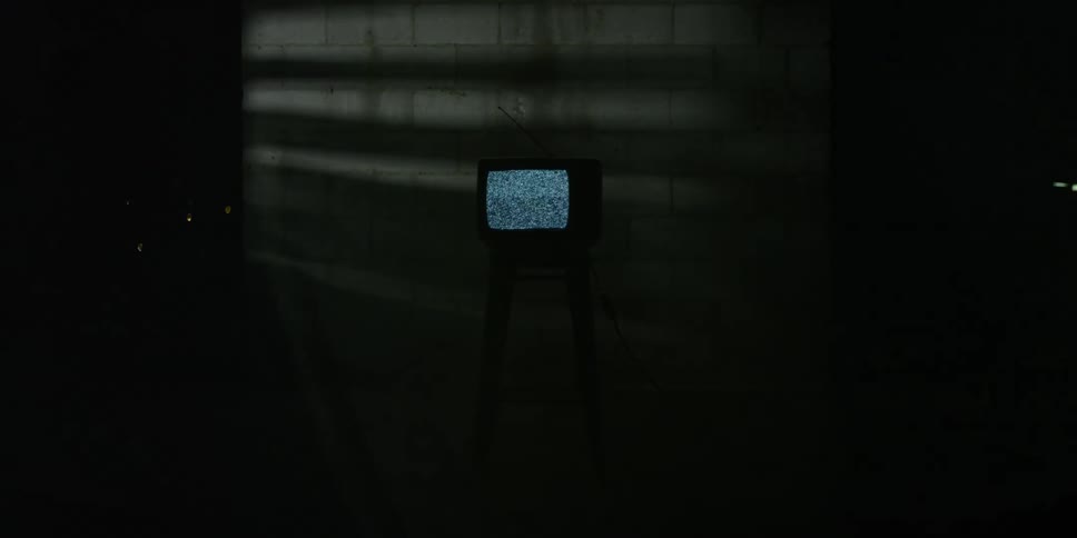 A television has static on the stool