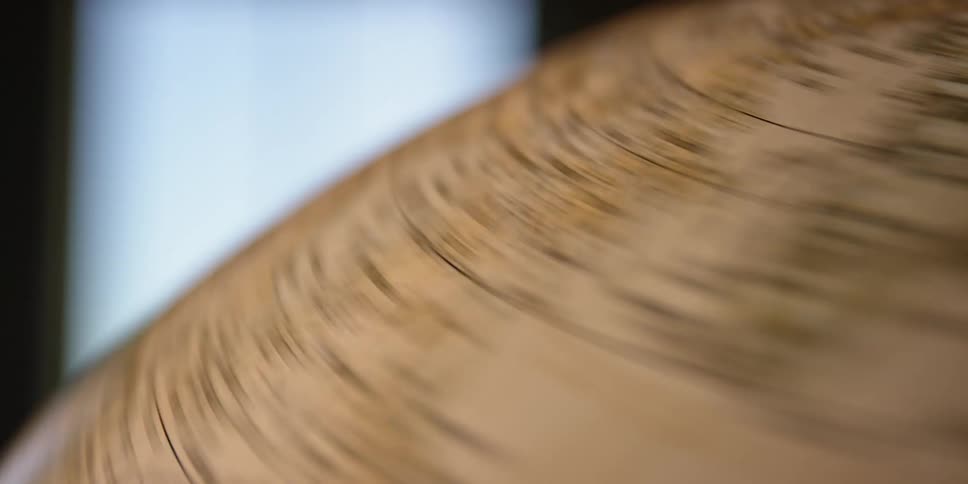 A rotating earth globe map is spun very quickly but loses momentum and ultimately comes to a stop