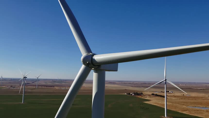Aerial view of a wind turbine spinning not in the wind farm