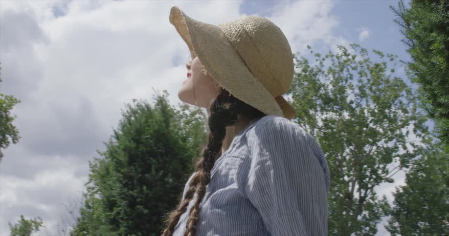 A woman gazing up at the sky