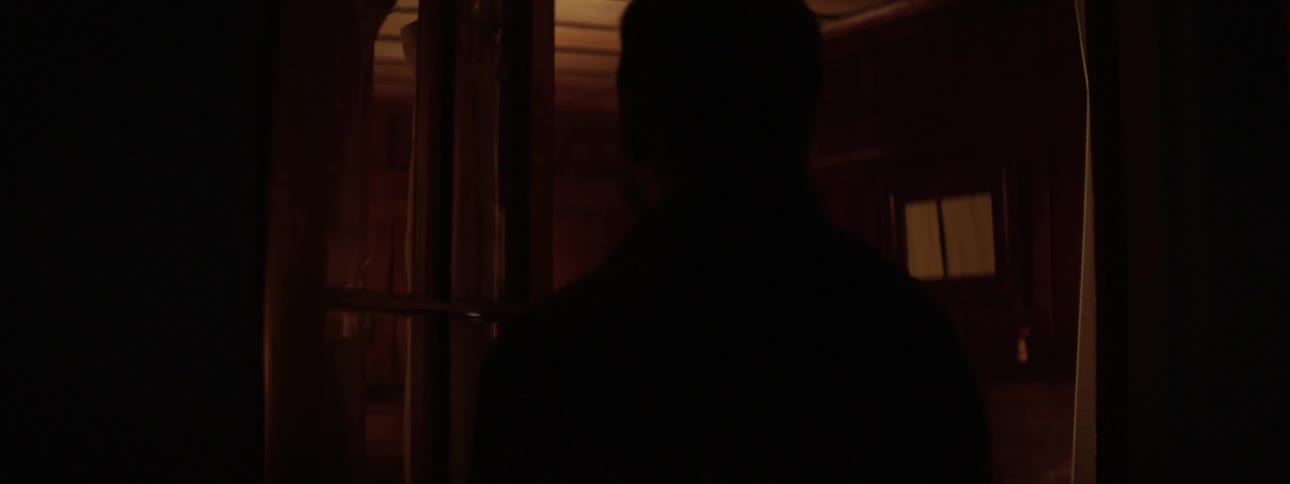 A man and woman enter a woman building at night and examine the inside