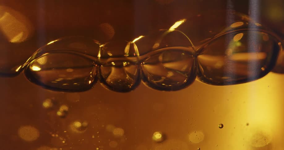 Bubbles form in a glass of beer