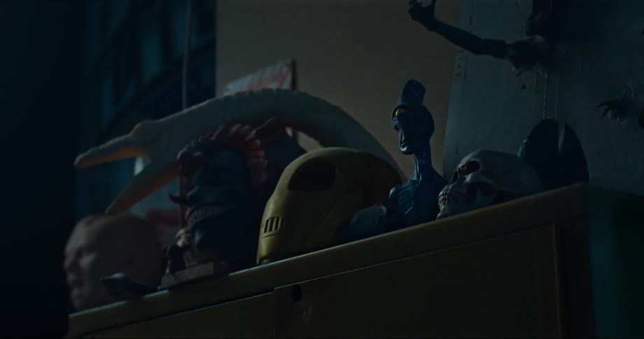 Toy models on the top of a cabinet in a dimly lit room