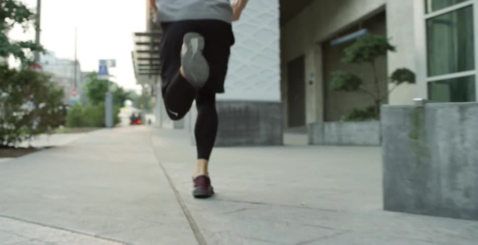 A man running down a city street