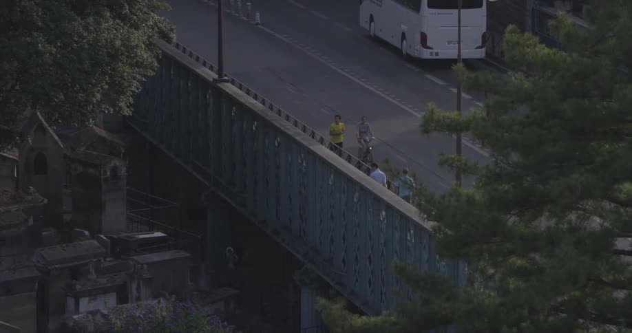 People walk, bike and jog down a road