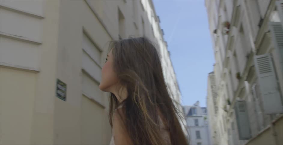 A woman walking along a city street