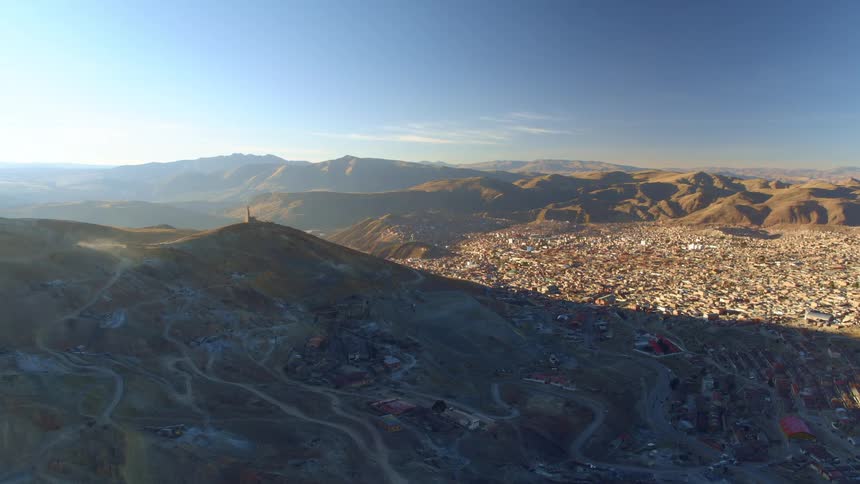 A small city in the valley between ridges of low mountains
