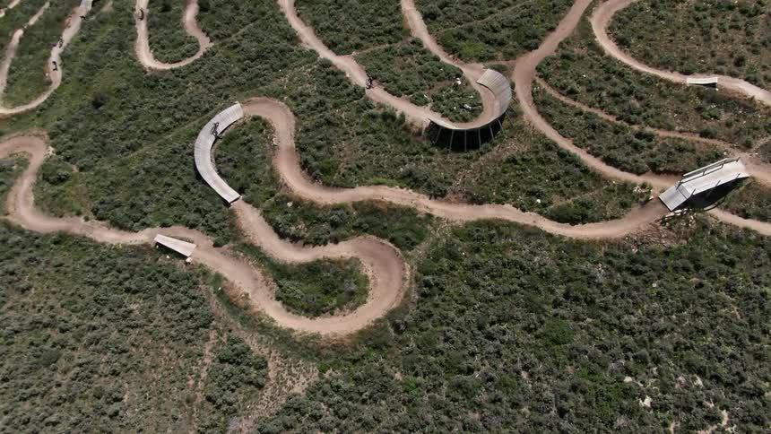 Cyclist riding bicycles on an off road mountain biking course
