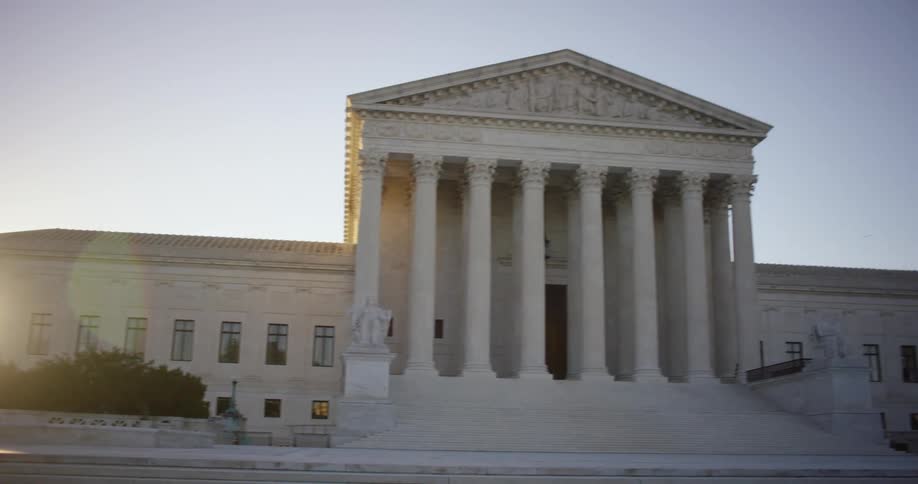 The supreme court building in washington dc at sunset