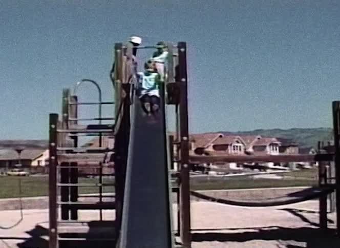 A child slides down into the sand