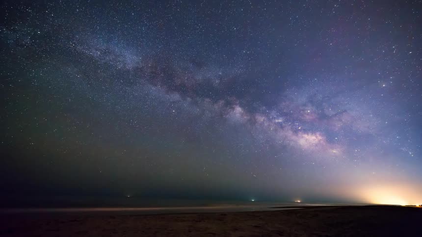 The night sky with stars shooting stars and the sun in the background