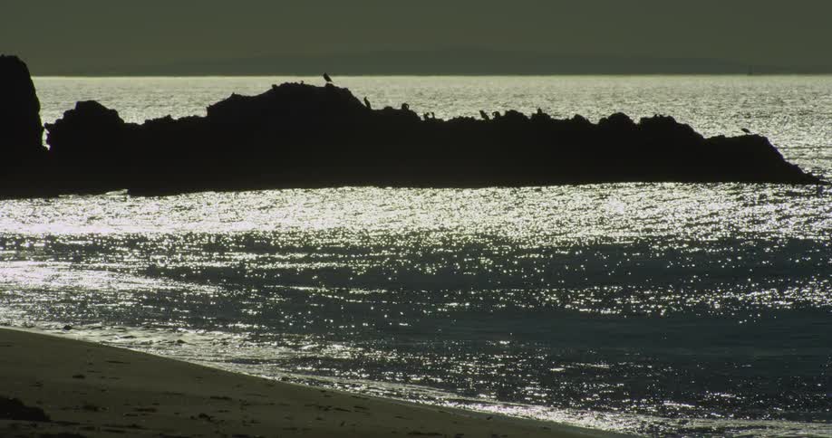 A view of the ocean is displayed at dusk