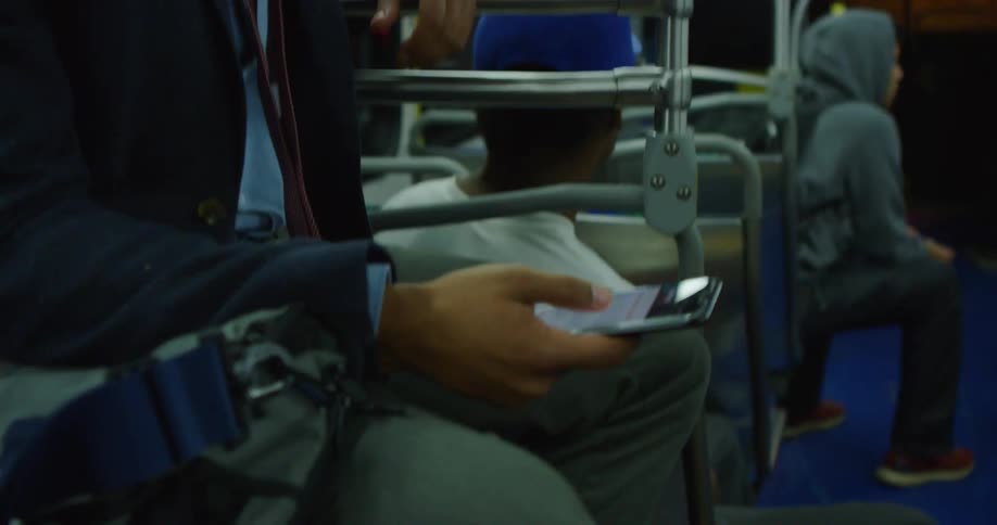 People are passengers on a public transportation bus