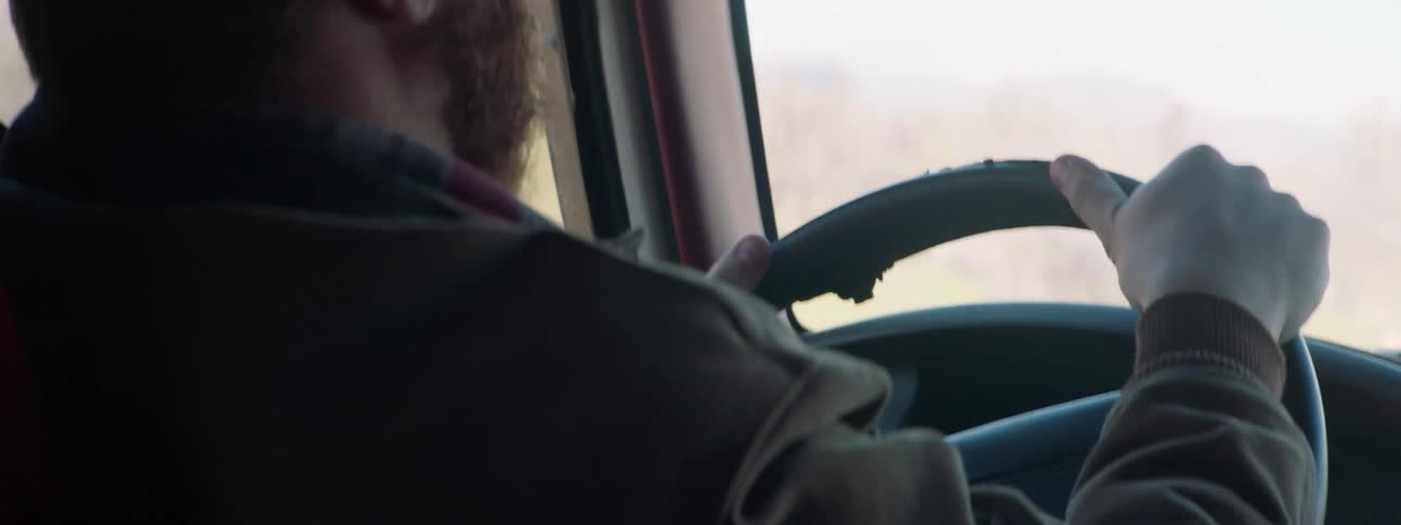A man drives his vehicle