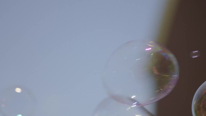 Large bubbles floating outdoors