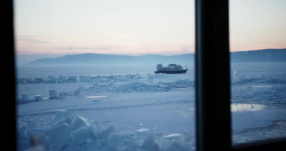 A boat going through the partially frozen water