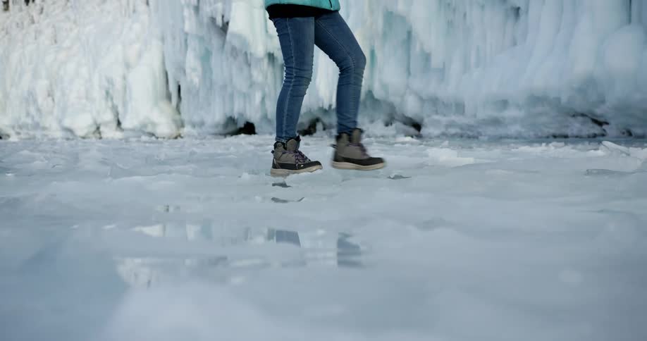 A person walking across ice