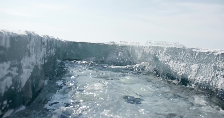 Interior of a square hole cut in the frozen ocean ice