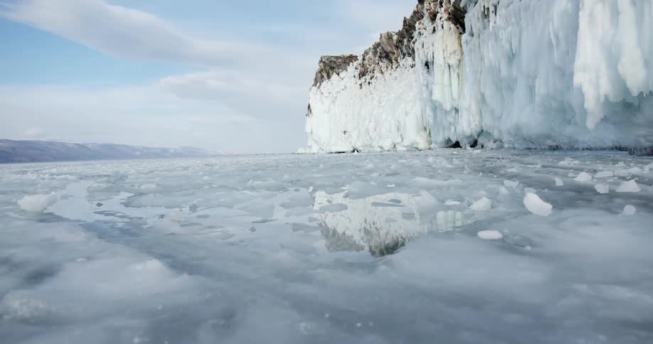 A large ice wall is on the shore