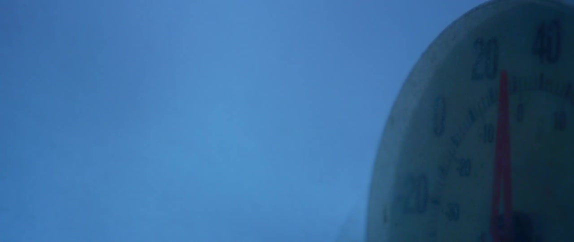 Close up of a thermometer dial during a winter storm