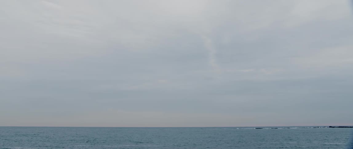 The sun sets on a calm wintery Atlantic Ocean