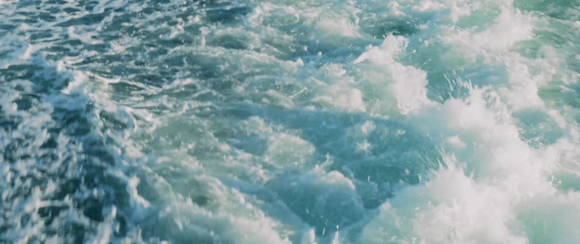 Water churns in the wake of a ship