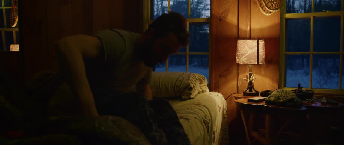 A man gets out of bed early on a cold winter morning