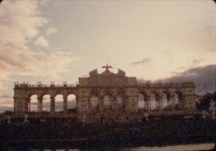 The Gloriette of the Schönbrunn Palace gardens at sunset