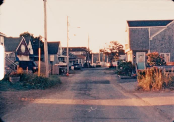 The sun rises over a small coastal village in Maine