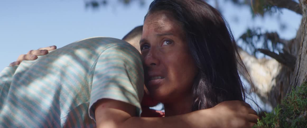 A little boy goes and hugs his mom who looks very upset