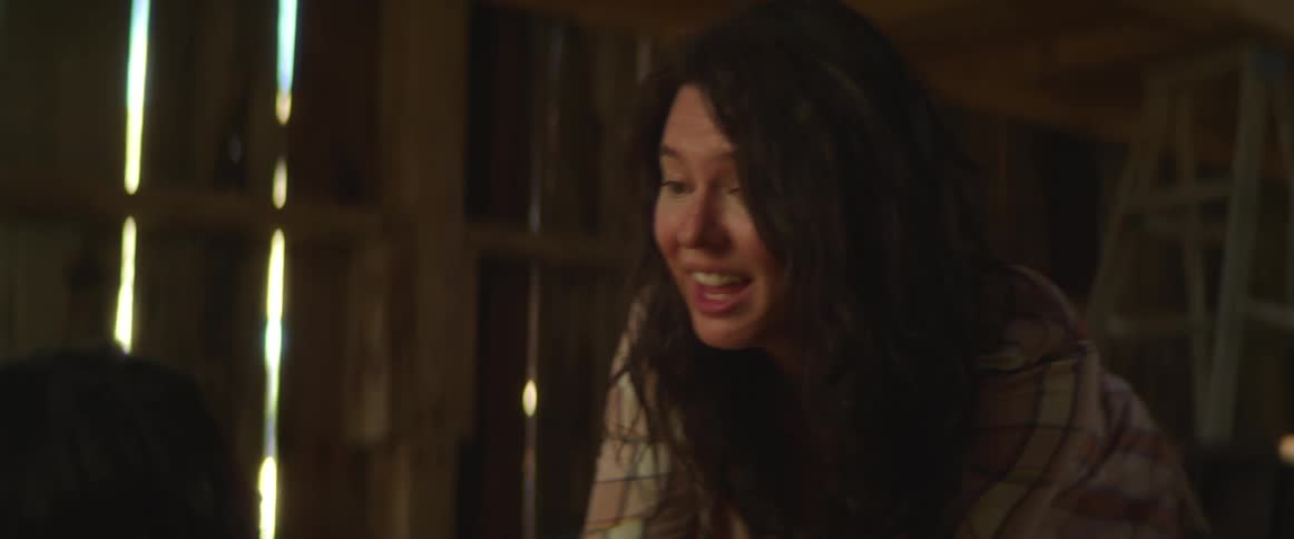 Worried woman helping another woman inside a barn runs away looking for help