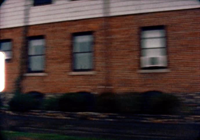 Driving through a rainy neighborhood outside of Boston Massachusetts