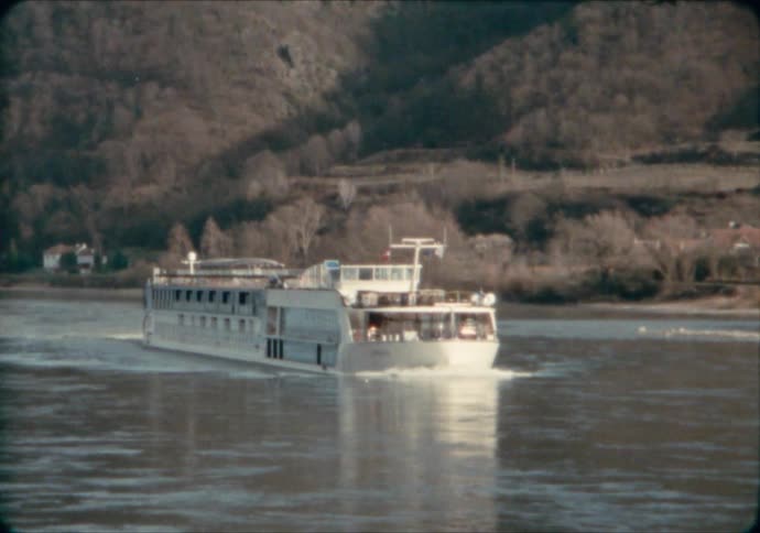 A river boat cruises along the Danube River