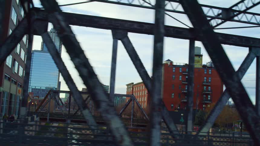 Bridges spanning a river in a city on a sunny day