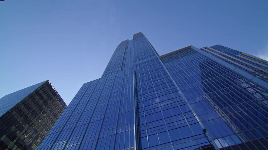 The sun is reflecting off the large buildings