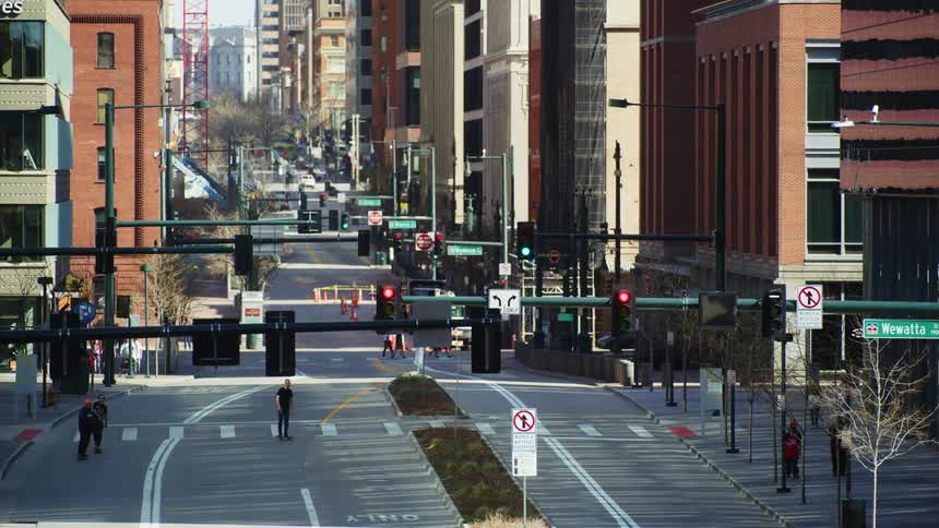 People travel around the city by foot car and skateboard