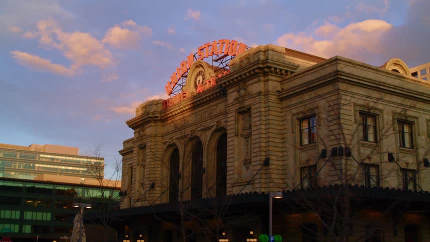 A view of a building in a downtown city is displayed