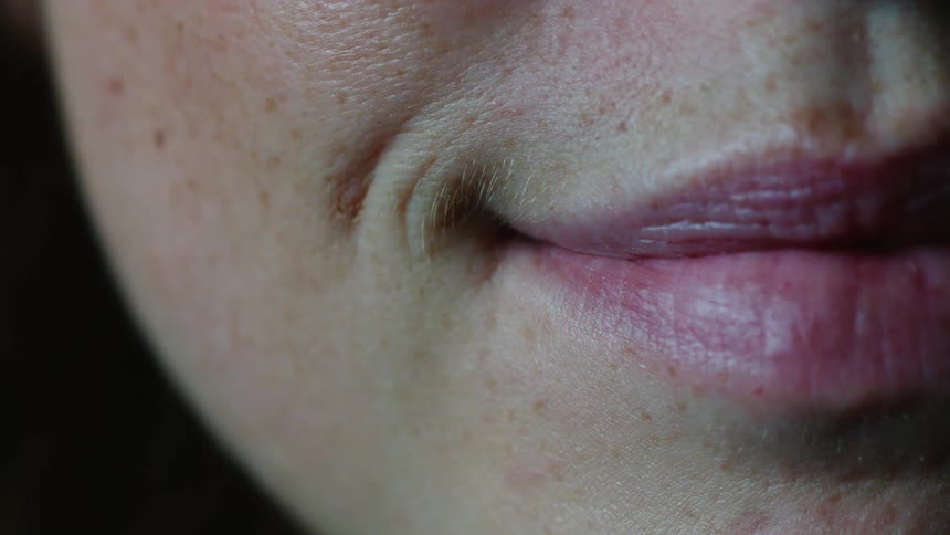 A close up of a female smiling