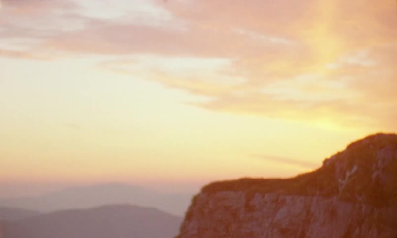A man takes the view in of the sky before hiking off