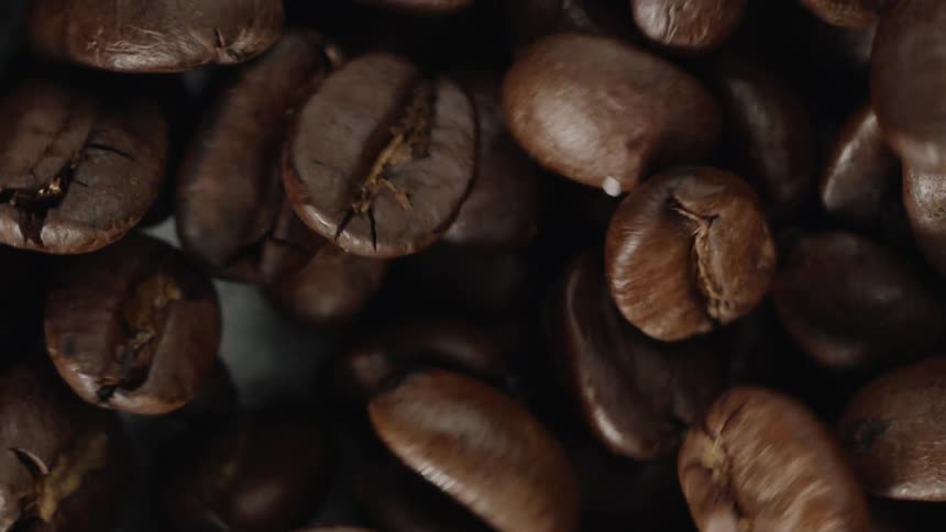 Close up of coffee beans moving