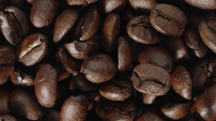 A pile of coffee beans briefly vibrate before becoming still again
