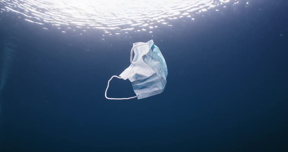 Surgical mask floats under the surface of the water