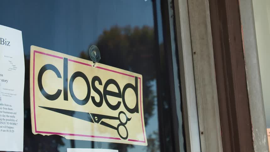 A store has a sign that says its closed