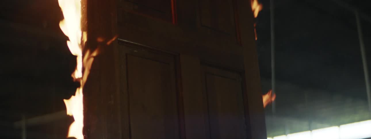 A door in a building is set on fire