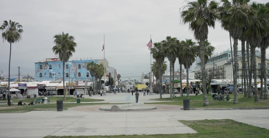 People walk in a city area on an overcast day